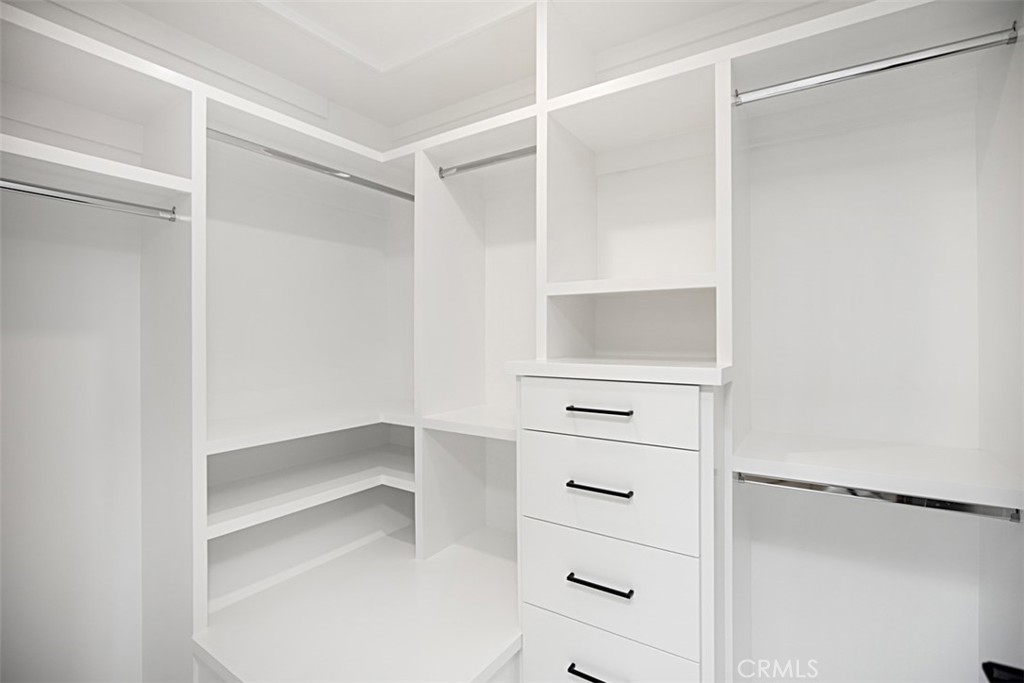 4017 Channel, Unit B Newport Beach, CA 92663 - Photo 11 of 18 a view of walk in closet with empty racks