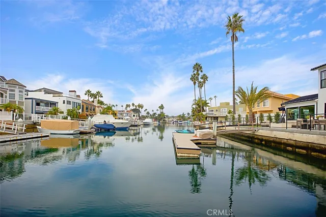 a view of a lake with couches and city view
