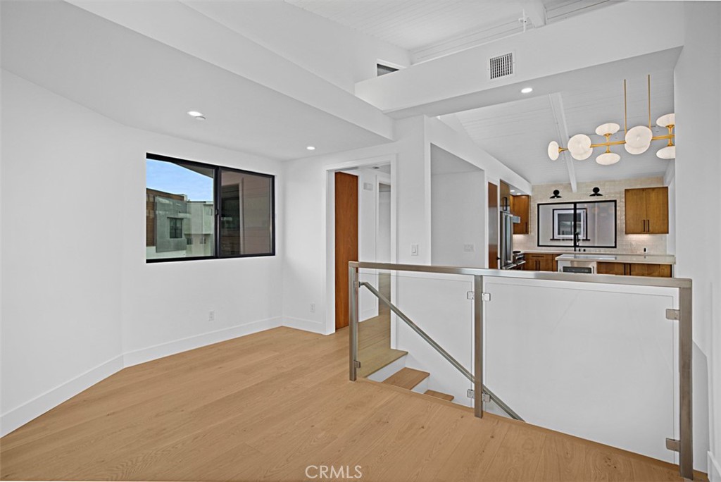 4017 Channel, Unit B Newport Beach, CA 92663 - Photo 7 of 18 a view of a kitchen with workspace and windows