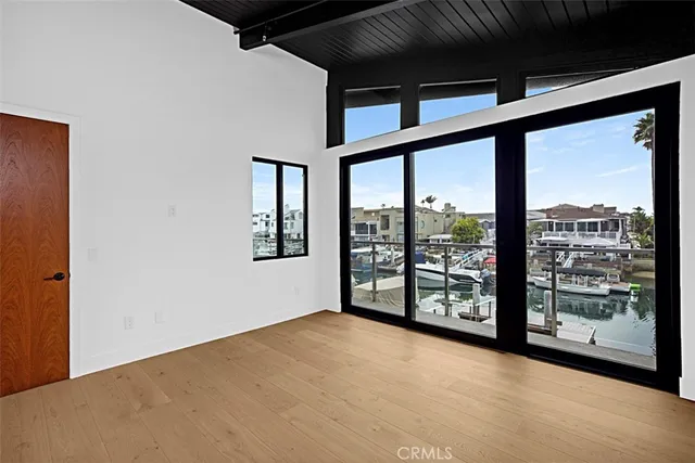 a view of an empty room with windows