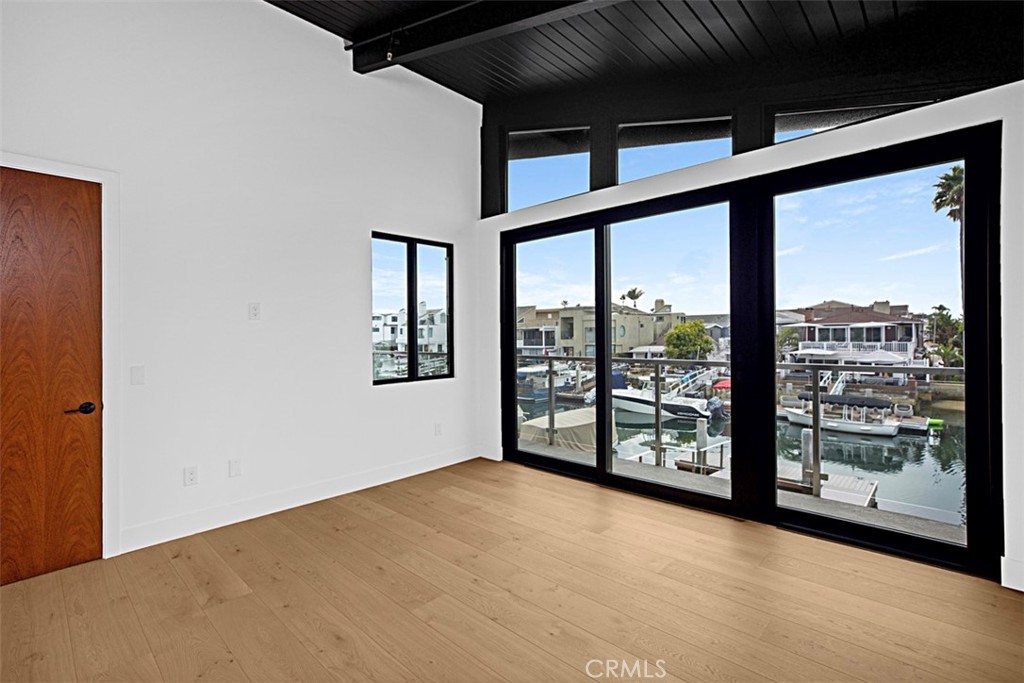 4017 Channel, Unit B Newport Beach, CA 92663 - Photo 8 of 18 a view of an empty room with windows