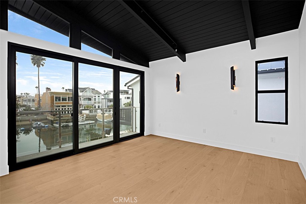 4017 Channel, Unit B Newport Beach, CA 92663 - Photo 9 of 18 a view of an empty room with windows