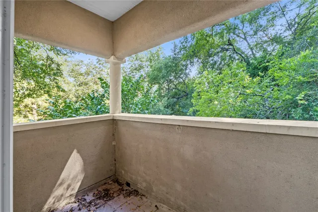 a view of a balcony with an outdoor space