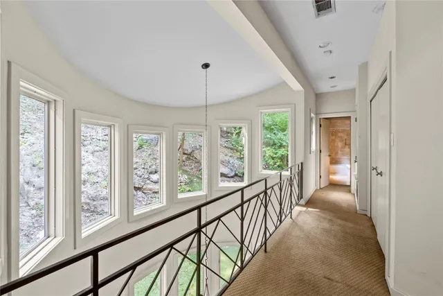 a view of hallway with furniture