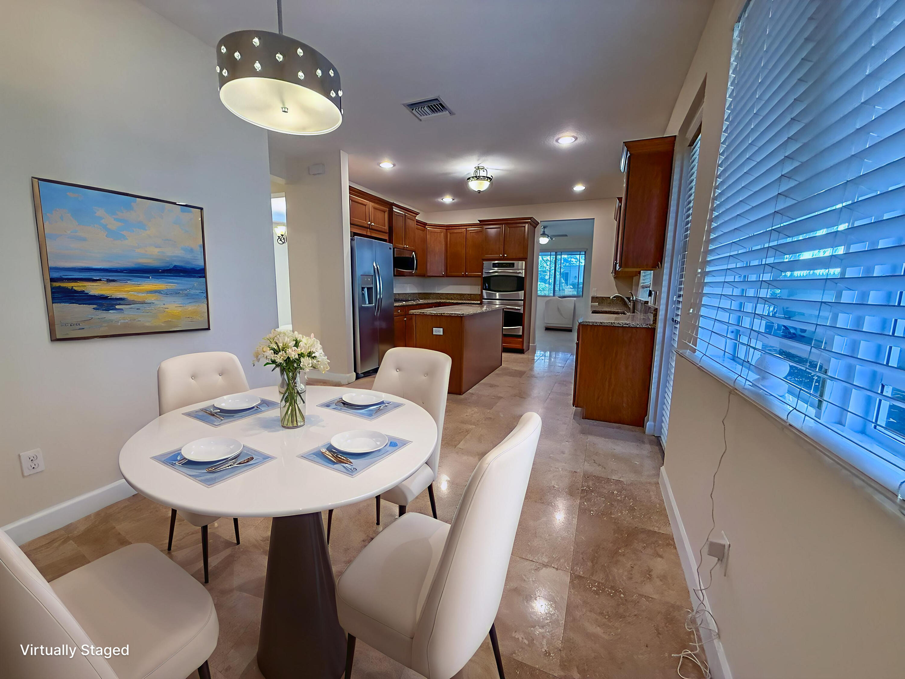 122 Northwest Gardner Street Boca Raton, FL 33432 - Photo 11 of 34 a view of a dining room with furniture