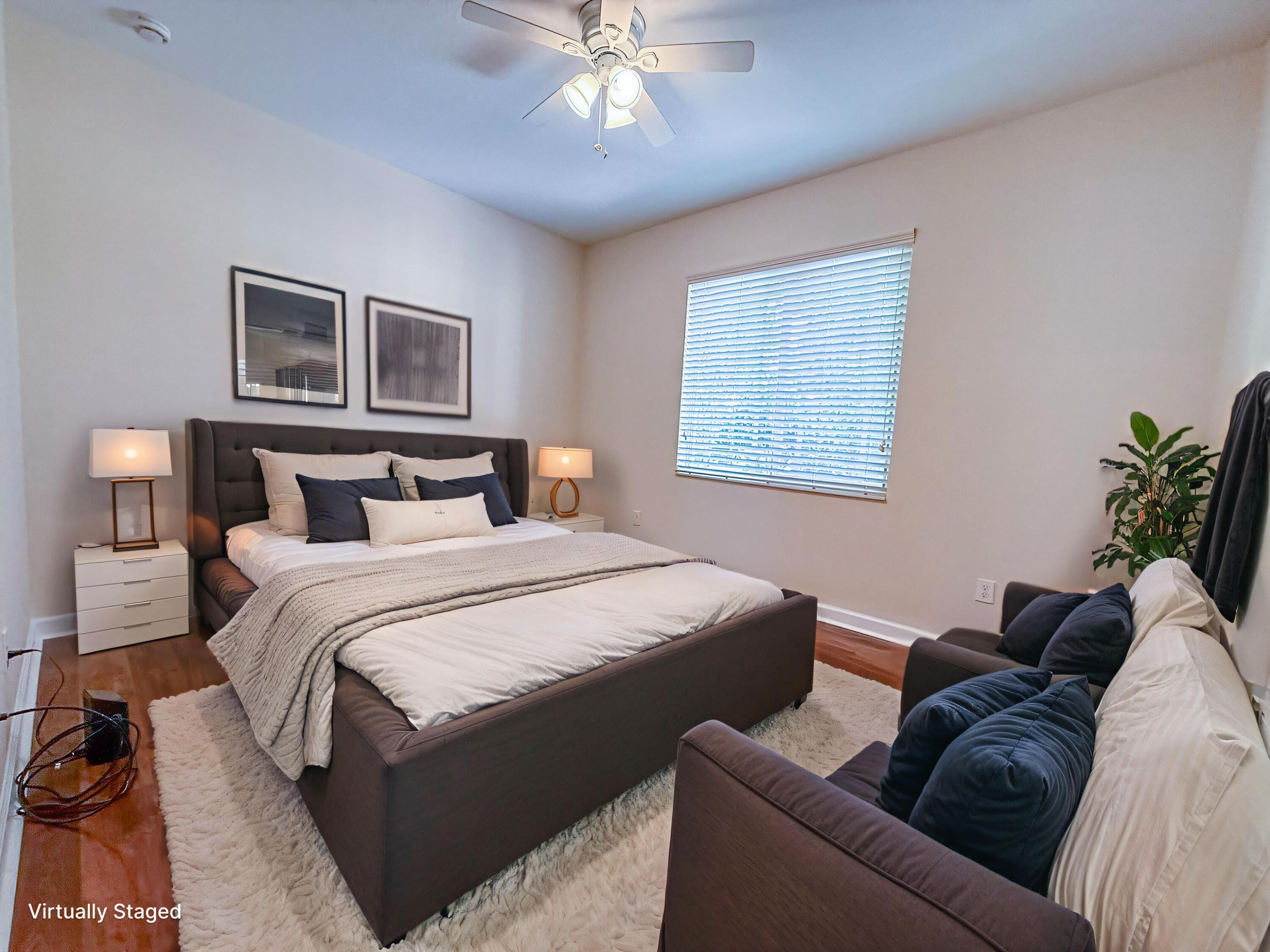 122 Northwest Gardner Street Boca Raton, FL 33432 - Photo 19 of 34 a bedroom with a bed couch and window