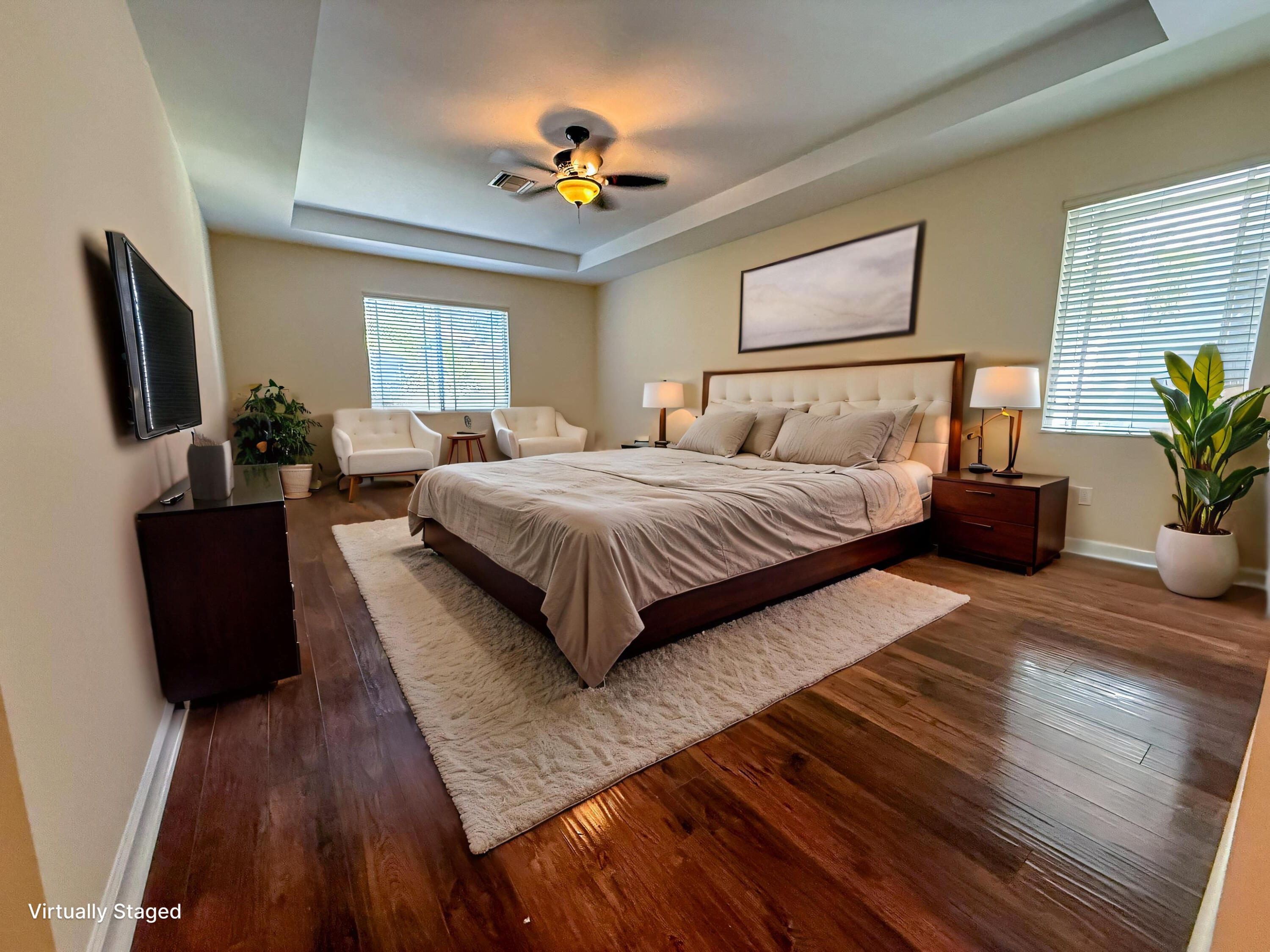 122 Northwest Gardner Street Boca Raton, FL 33432 - Photo 26 of 34 a bedroom with a bed and a flat screen tv