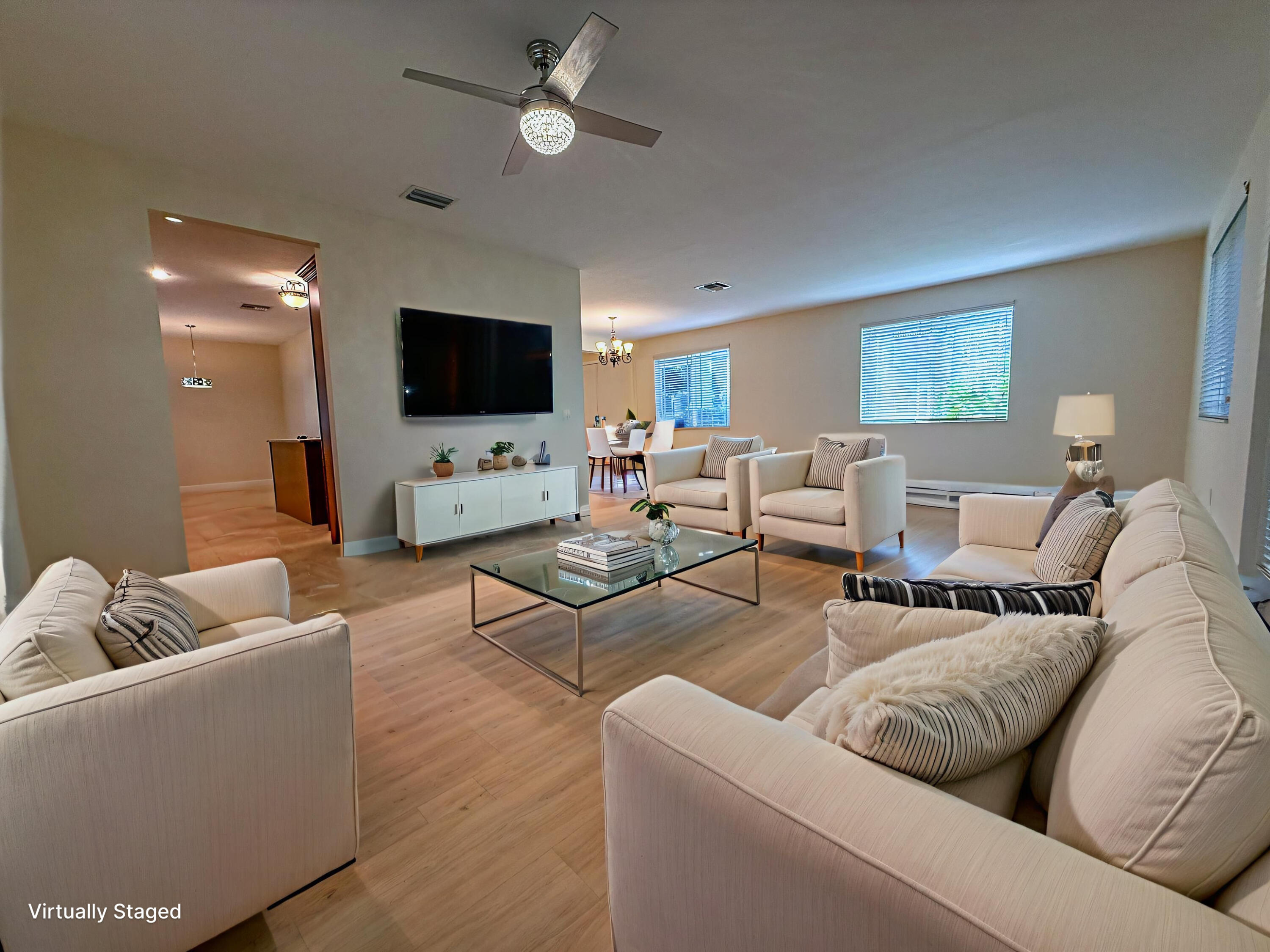 122 Northwest Gardner Street Boca Raton, FL 33432 - Photo 8 of 34 a living room with furniture and a flat screen tv