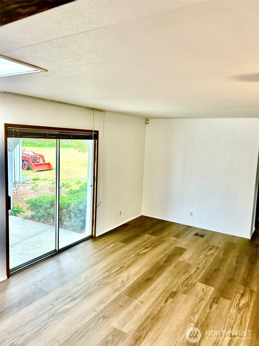 791 Elliot Court Sequim, WA 98382 - Photo 12 of 37 a view of empty room with wooden floor