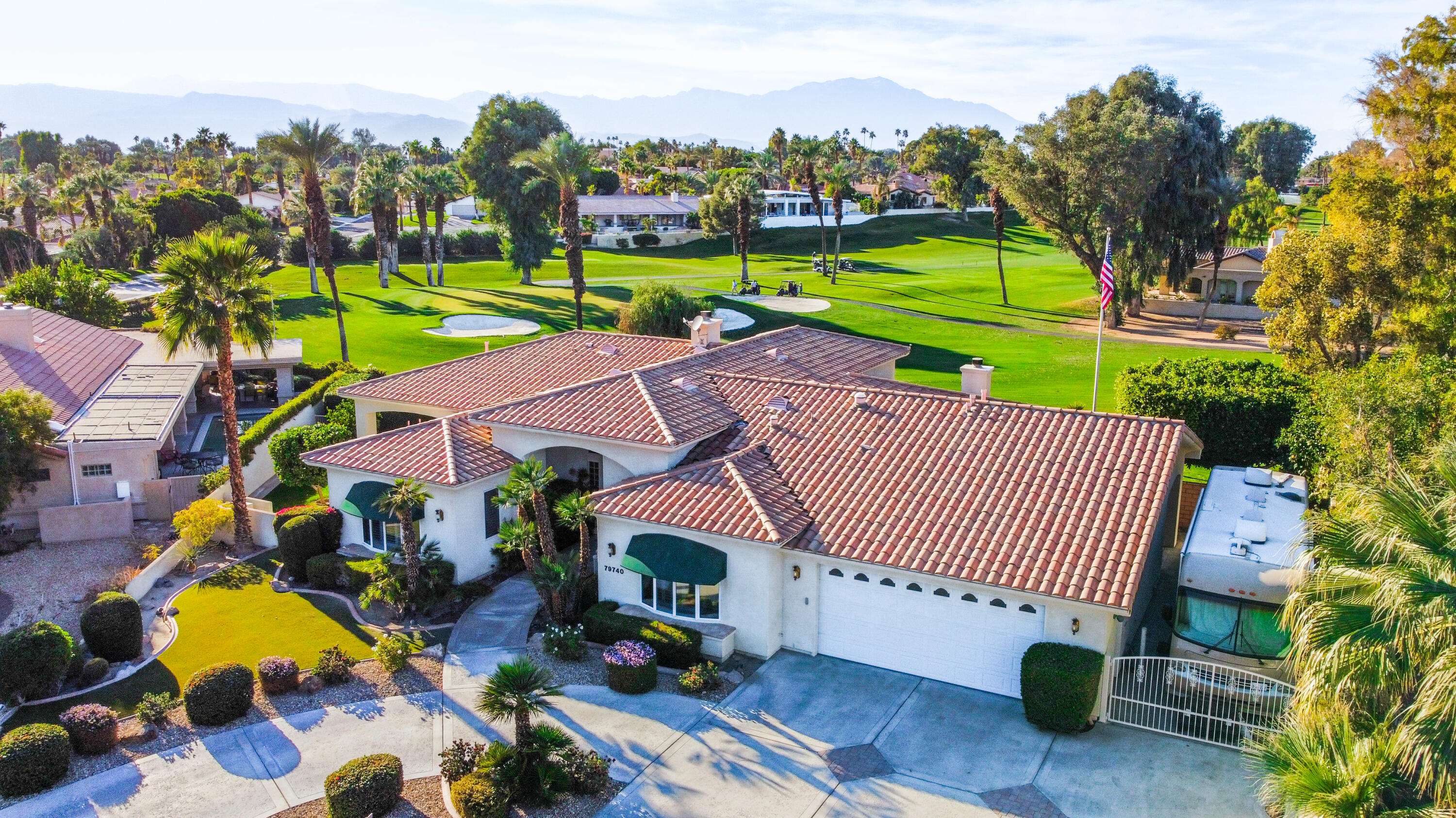 an aerial view of a house with garden space and street view