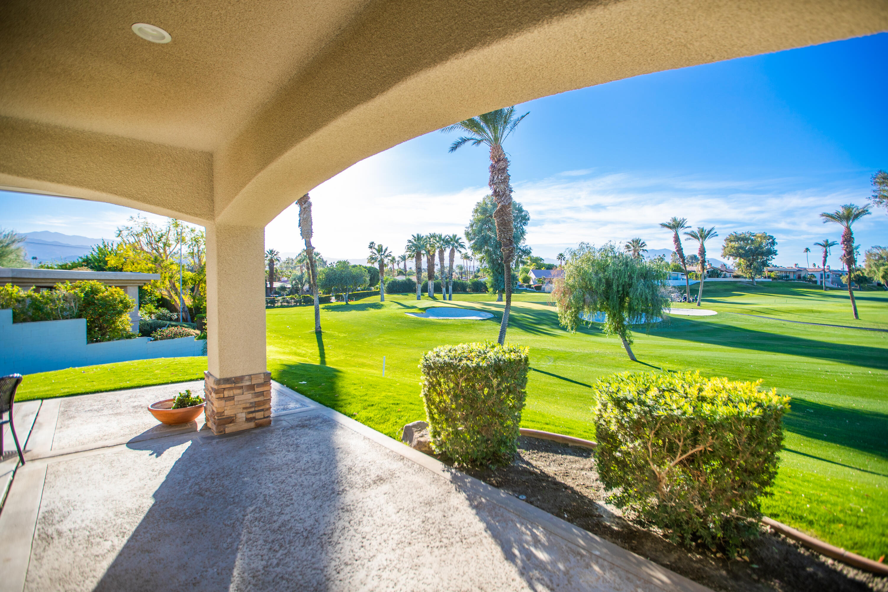 79740 Ryan Way Bermuda Dunes, CA 92203 - Photo 13 of 43 a view of a swimming pool with a patio and a yard