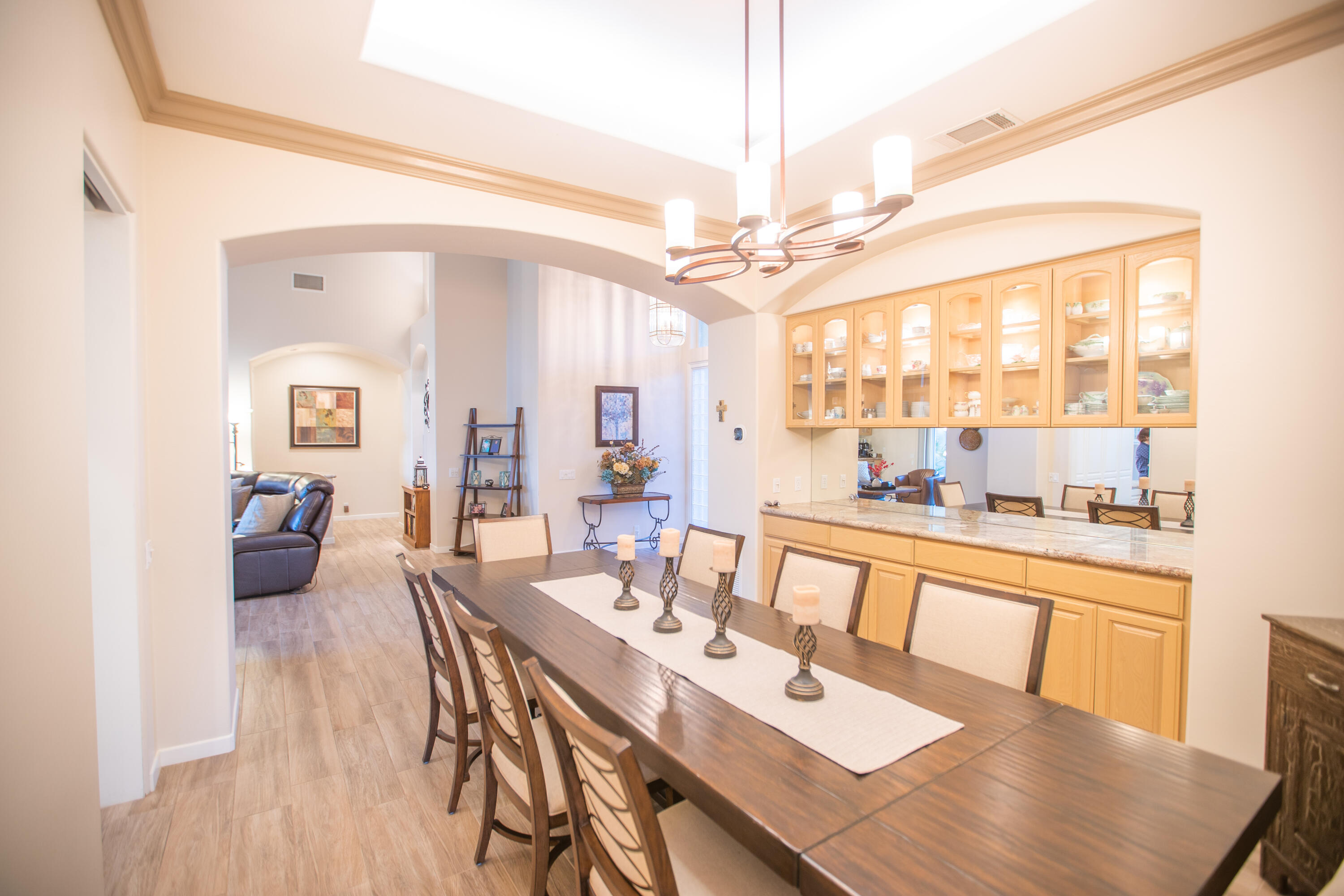 79740 Ryan Way Bermuda Dunes, CA 92203 - Photo 18 of 43 a view of a dining room and livingroom with furniture wooden floor a chandelier