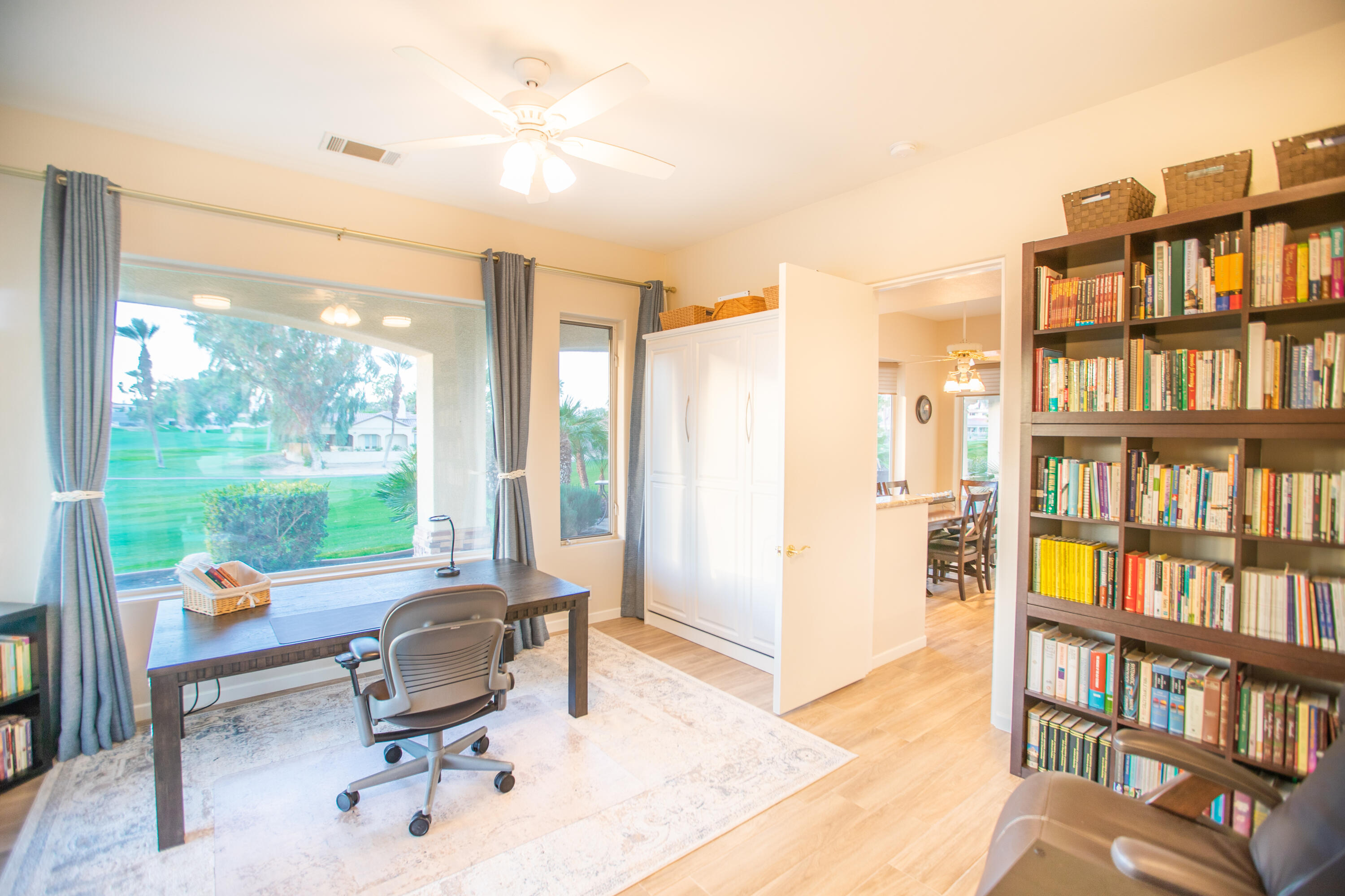 79740 Ryan Way Bermuda Dunes, CA 92203 - Photo 20 of 43 a view of a livingroom with workspace and a bookshelf