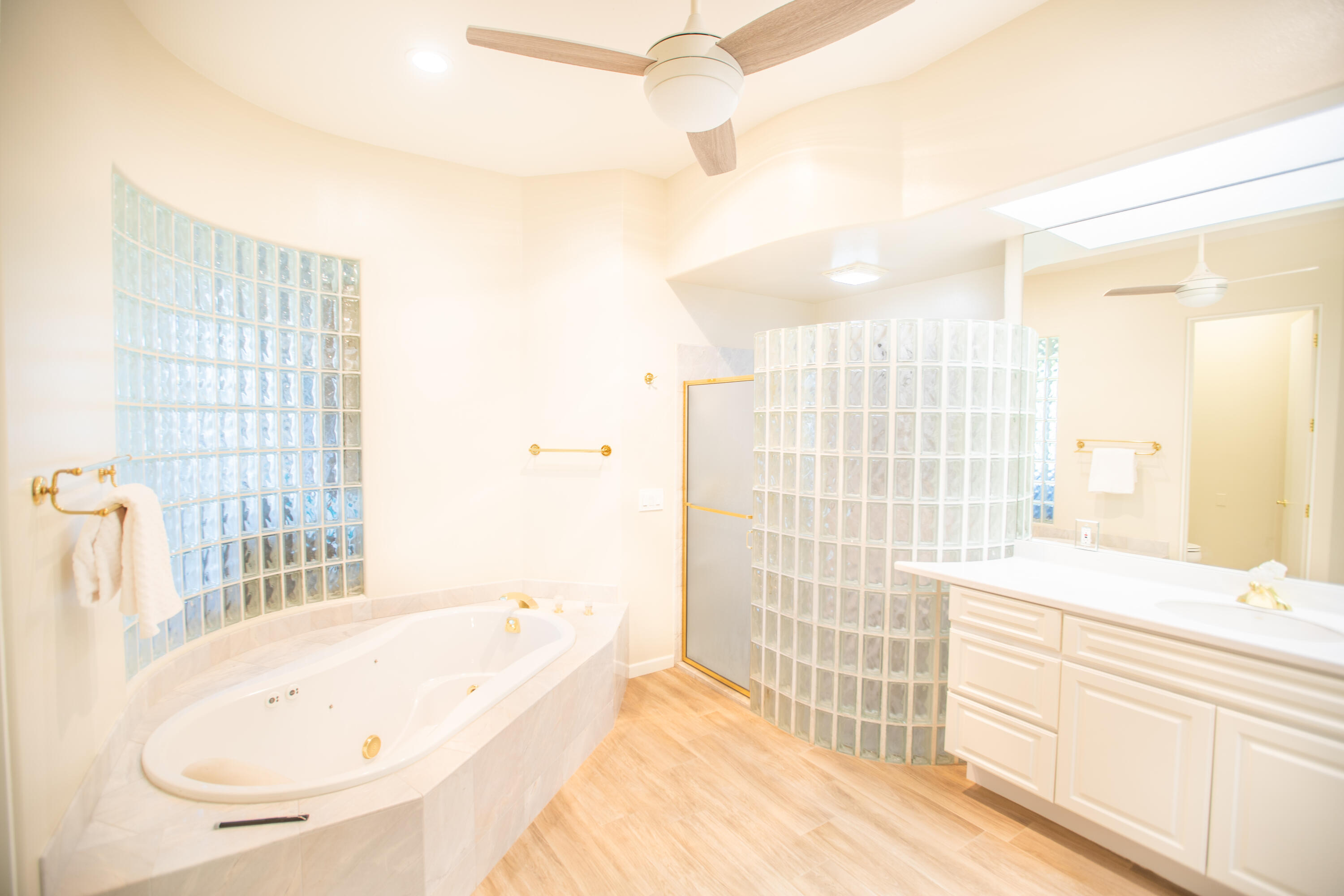 79740 Ryan Way Bermuda Dunes, CA 92203 - Photo 29 of 43 a bathroom with a tub sink and a shower