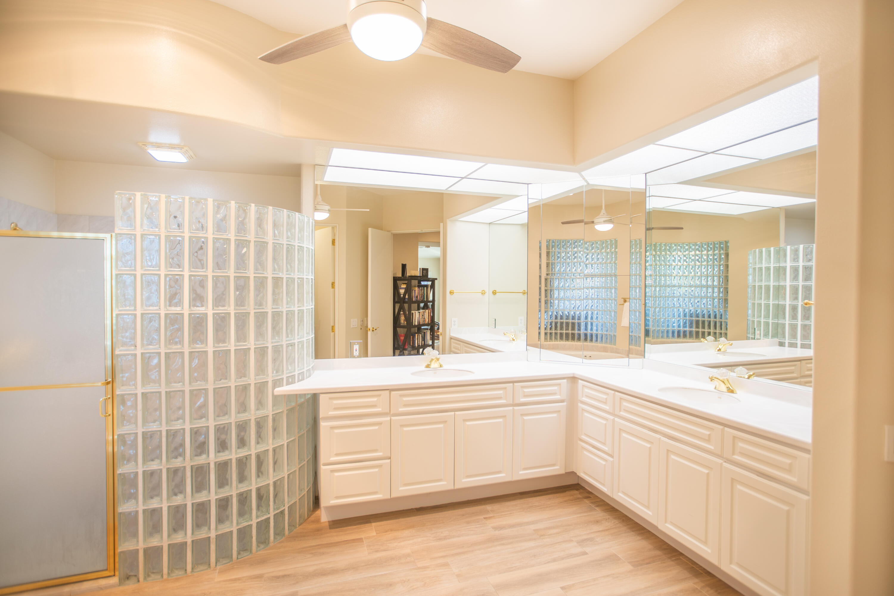 79740 Ryan Way Bermuda Dunes, CA 92203 - Photo 30 of 43 a large white bathroom with a sink a bathtub and a shower