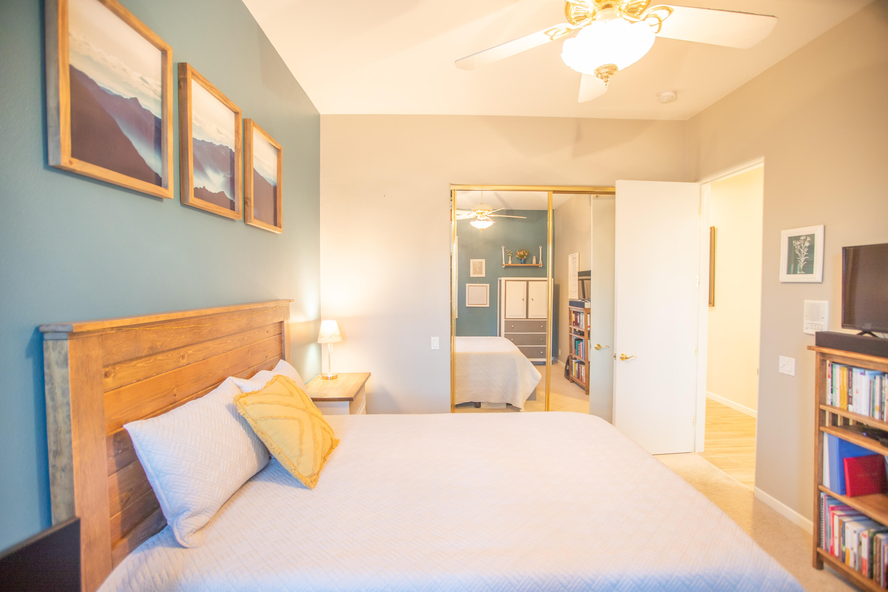 79740 Ryan Way Bermuda Dunes, CA 92203 - Photo 34 of 43 a bedroom with a bed and a book shelf