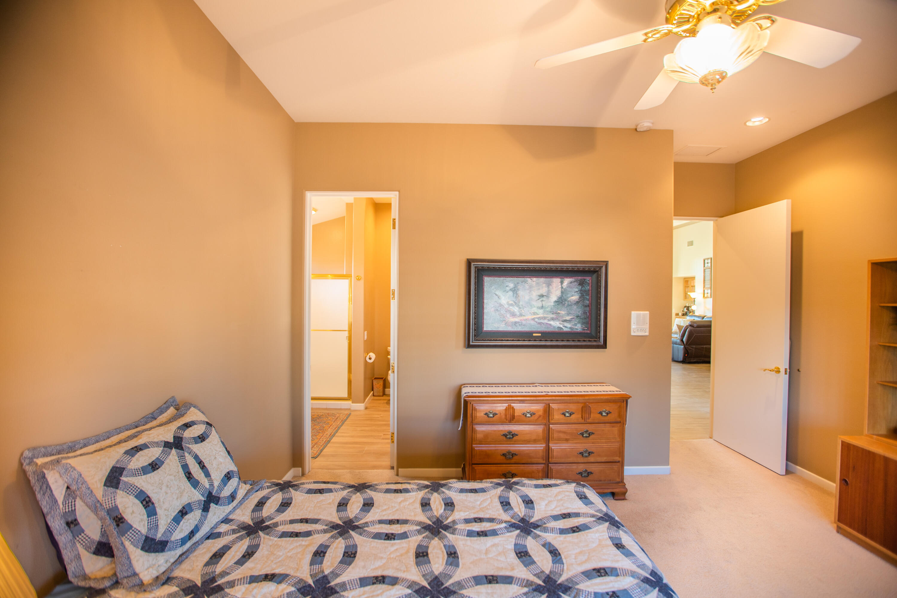 79740 Ryan Way Bermuda Dunes, CA 92203 - Photo 38 of 43 a bedroom with a bed and wooden floor