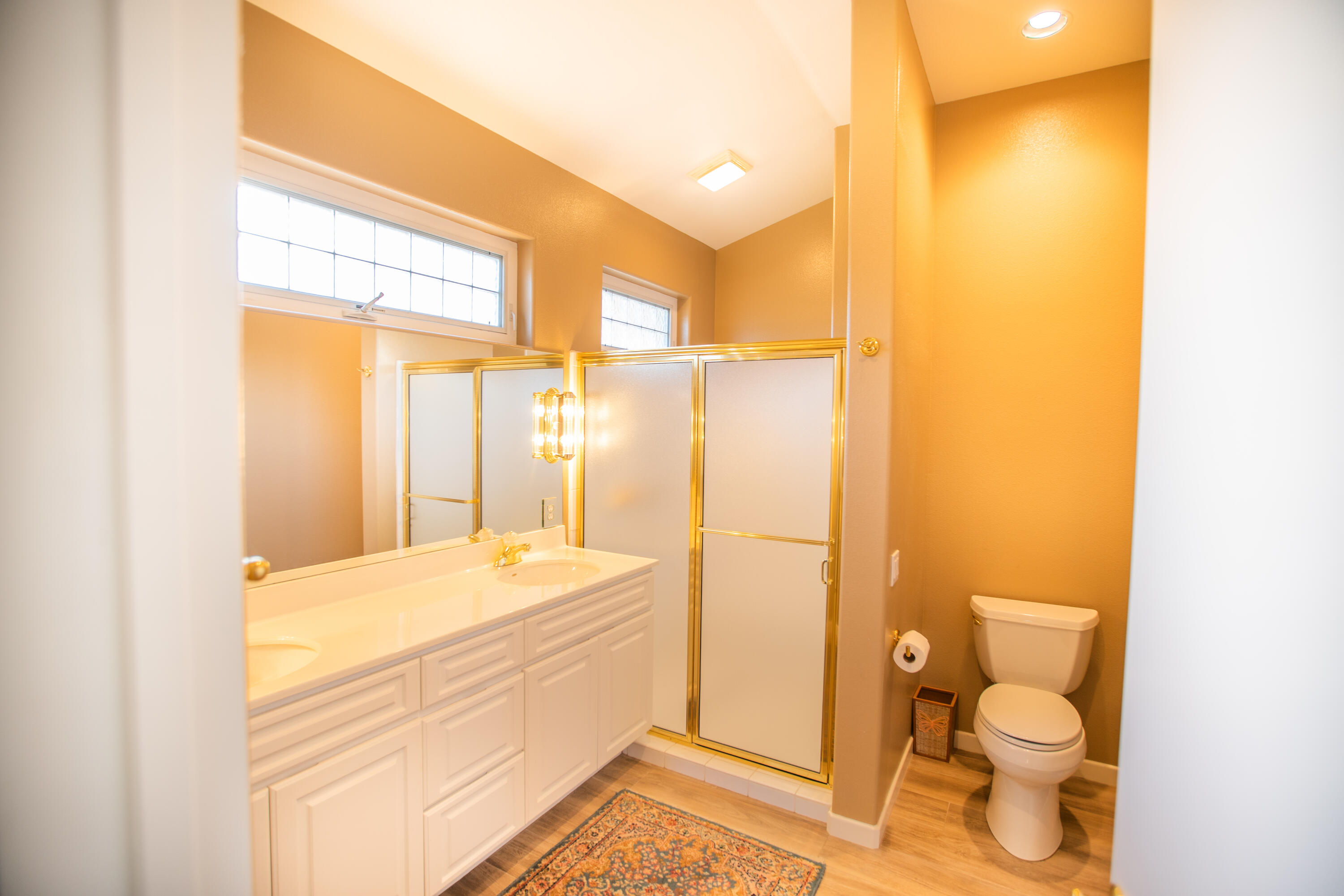 79740 Ryan Way Bermuda Dunes, CA 92203 - Photo 39 of 43 a bathroom with a granite countertop sink toilet and shower