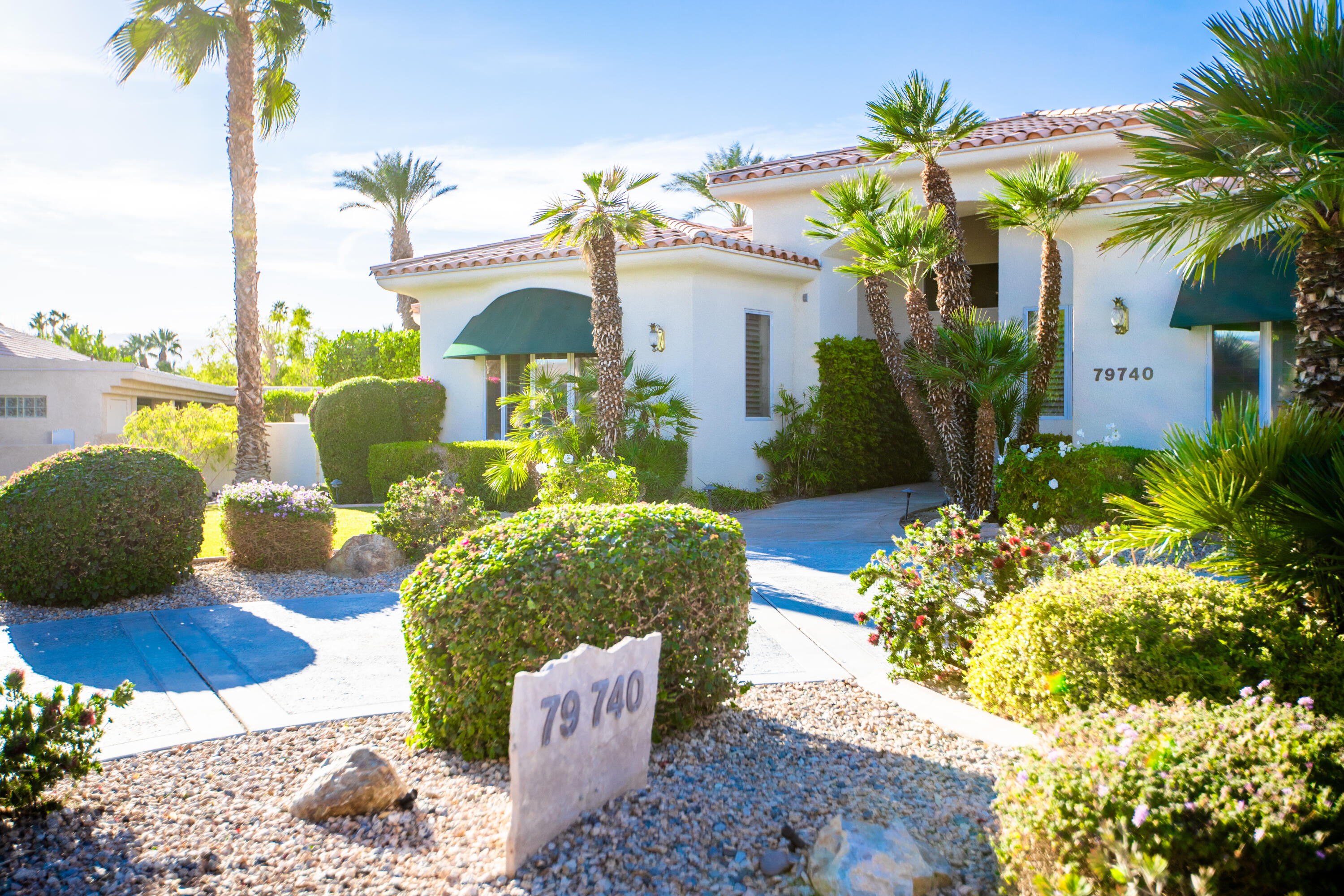 79740 Ryan Way Bermuda Dunes, CA 92203 - Photo 5 of 43 a front view of a house with garden