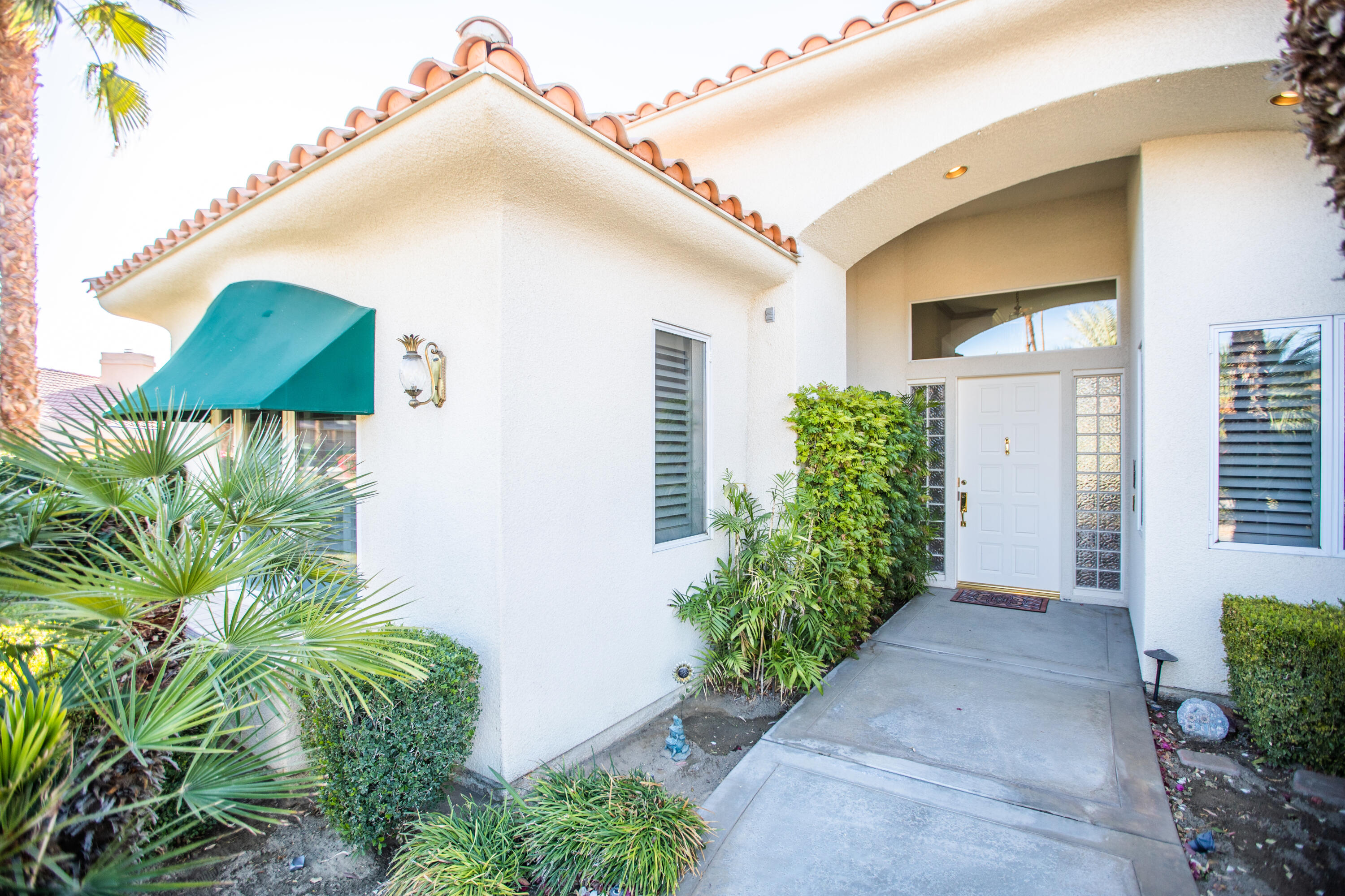 79740 Ryan Way Bermuda Dunes, CA 92203 - Photo 6 of 43 a front view of a house with garden