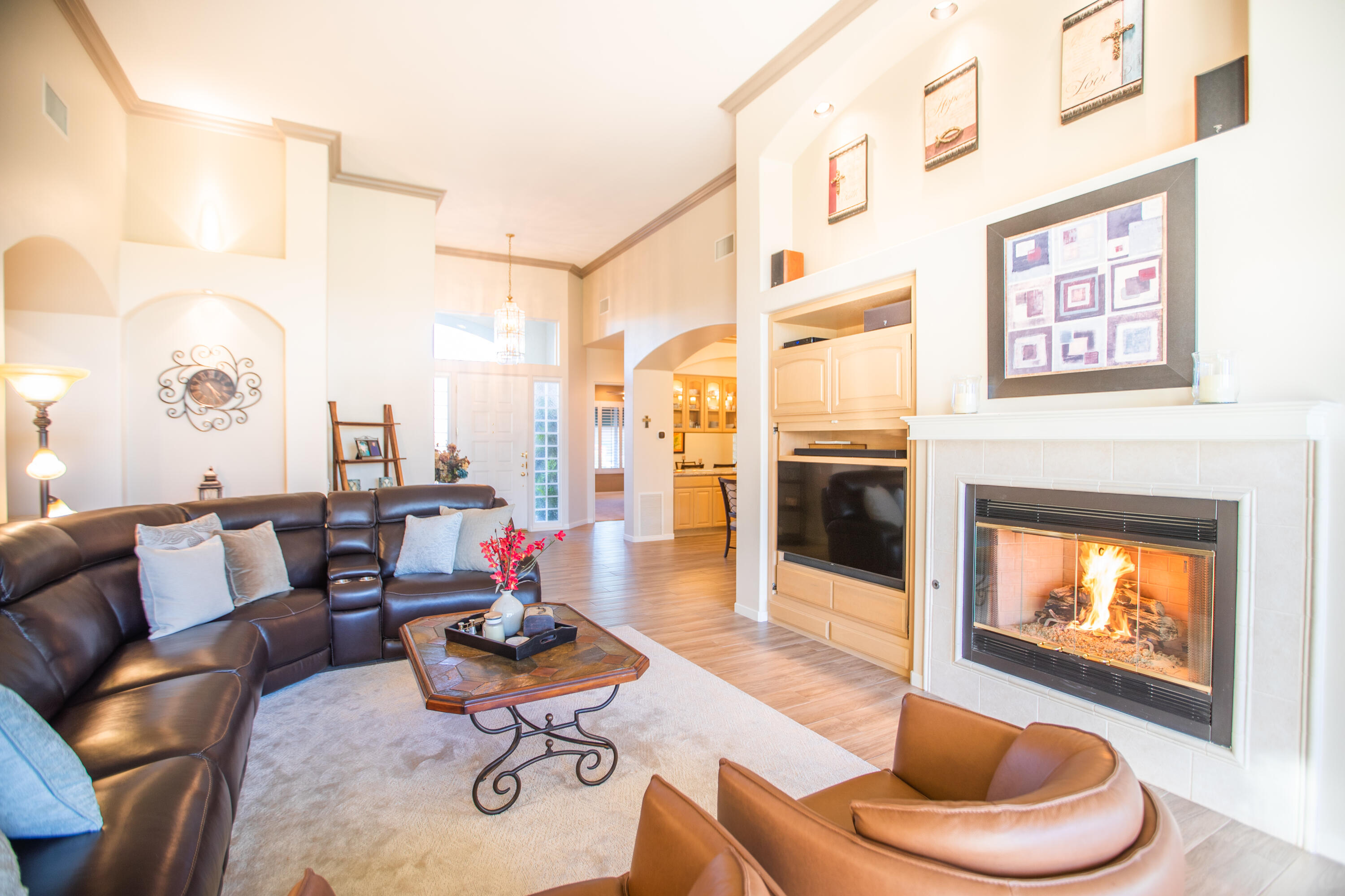 79740 Ryan Way Bermuda Dunes, CA 92203 - Photo 8 of 43 a living room with furniture kitchen view and a fireplace