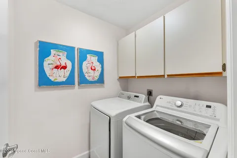 a view of a house with swimming pool and a yard