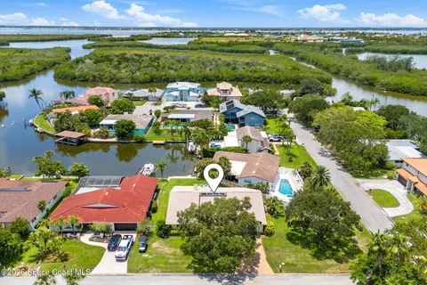 an aerial view of residential houses with outdoor space
