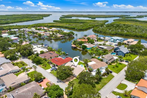 an aerial view of residential houses with outdoor space