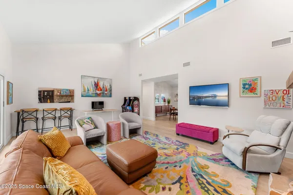 a bedroom with a bed a table and chair