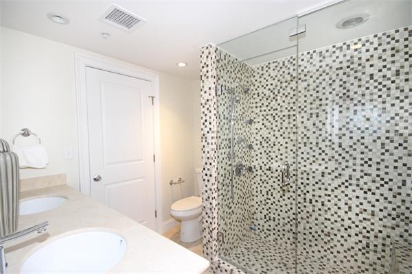 9 North Margin Street Boston, MA 02113 - Photo 14 of 19 a bathroom with a bathtub shower sink vanity and toilet