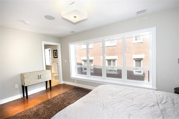 9 North Margin Street Boston, MA 02113 - Photo 18 of 19 a bedroom with a bed and a large window with the outer view