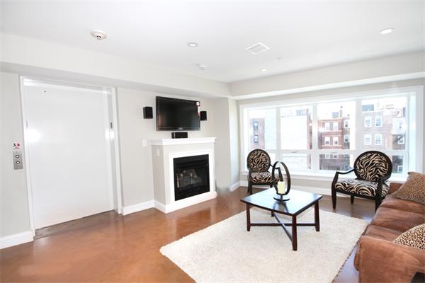 9 North Margin Street Boston, MA 02113 - Photo 5 of 19 a living room with furniture a fireplace and a flat screen tv