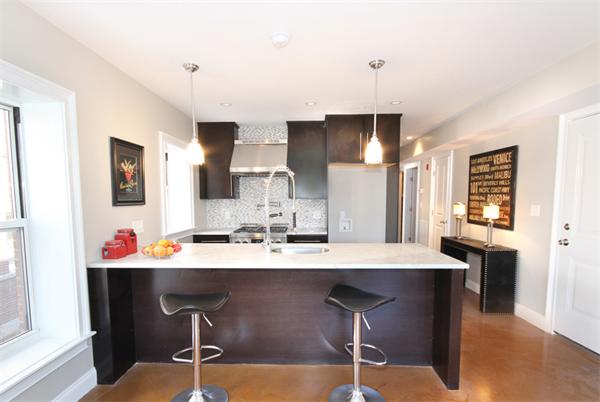 9 North Margin Street Boston, MA 02113 - Photo 7 of 19 a view of a dining room kitchen with a table and chairs