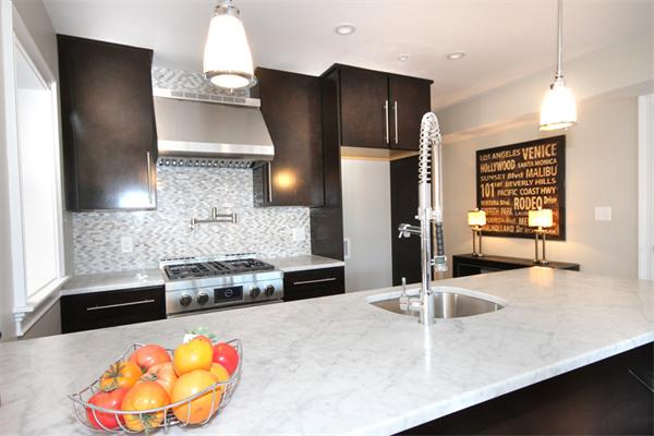 9 North Margin Street Boston, MA 02113 - Photo 8 of 19 a kitchen with stainless steel appliances a refrigerator a stove and wooden floor