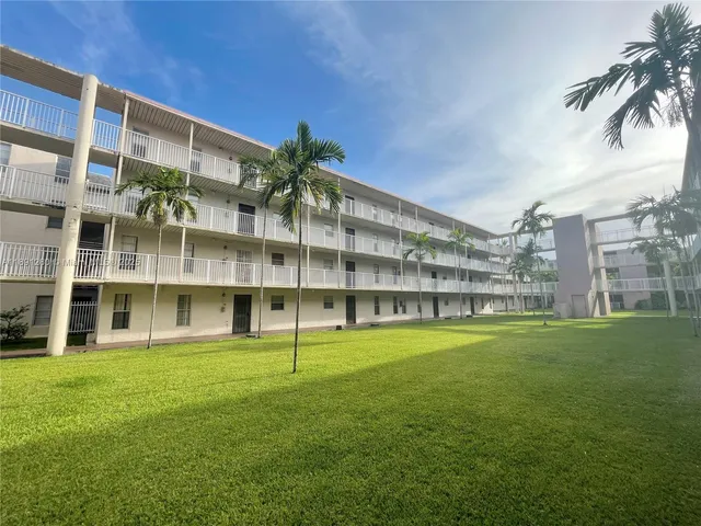 a view of building with yard