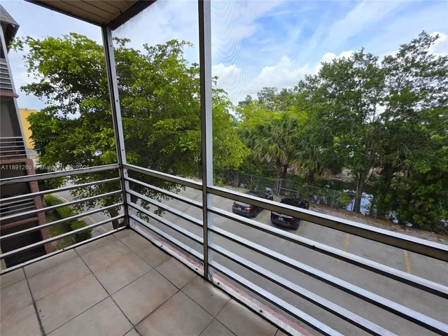a view of a back yard from a balcony