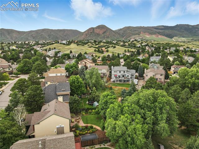 2130 Wickes Road Colorado Springs, CO 80919 - Photo 47 of 49 Aerial overview of property's location featuring nearby suburban area and a mountain backdrop