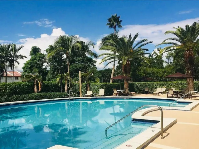 front view of a building with a garden