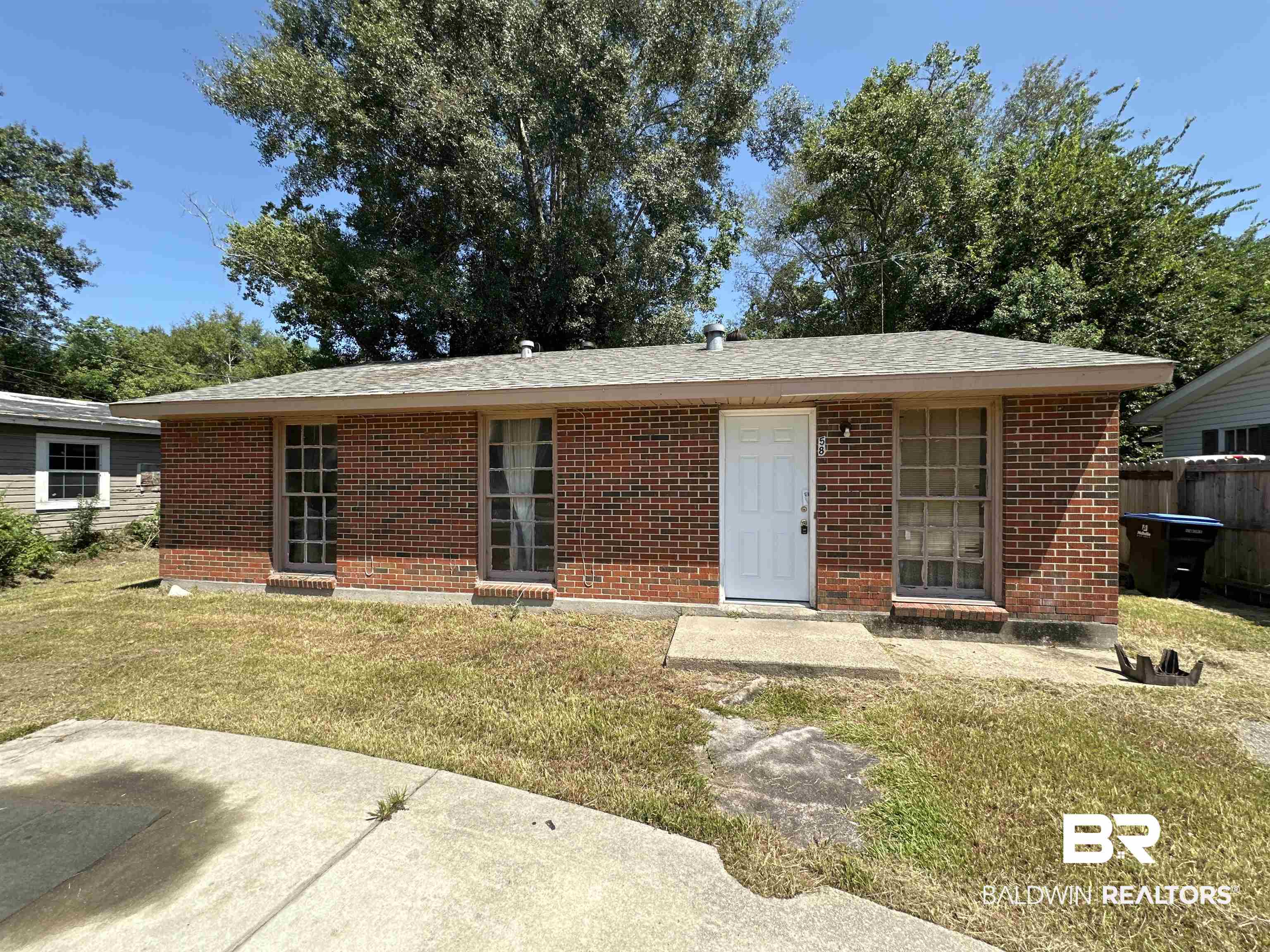 58 Chieftain Way Mobile, AL 36611 - Photo 6 of 12 Back of property featuring a lawn and a patio