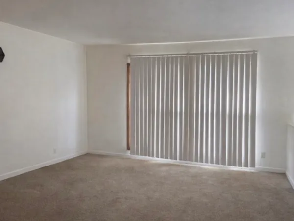 a view of a empty room with a window
