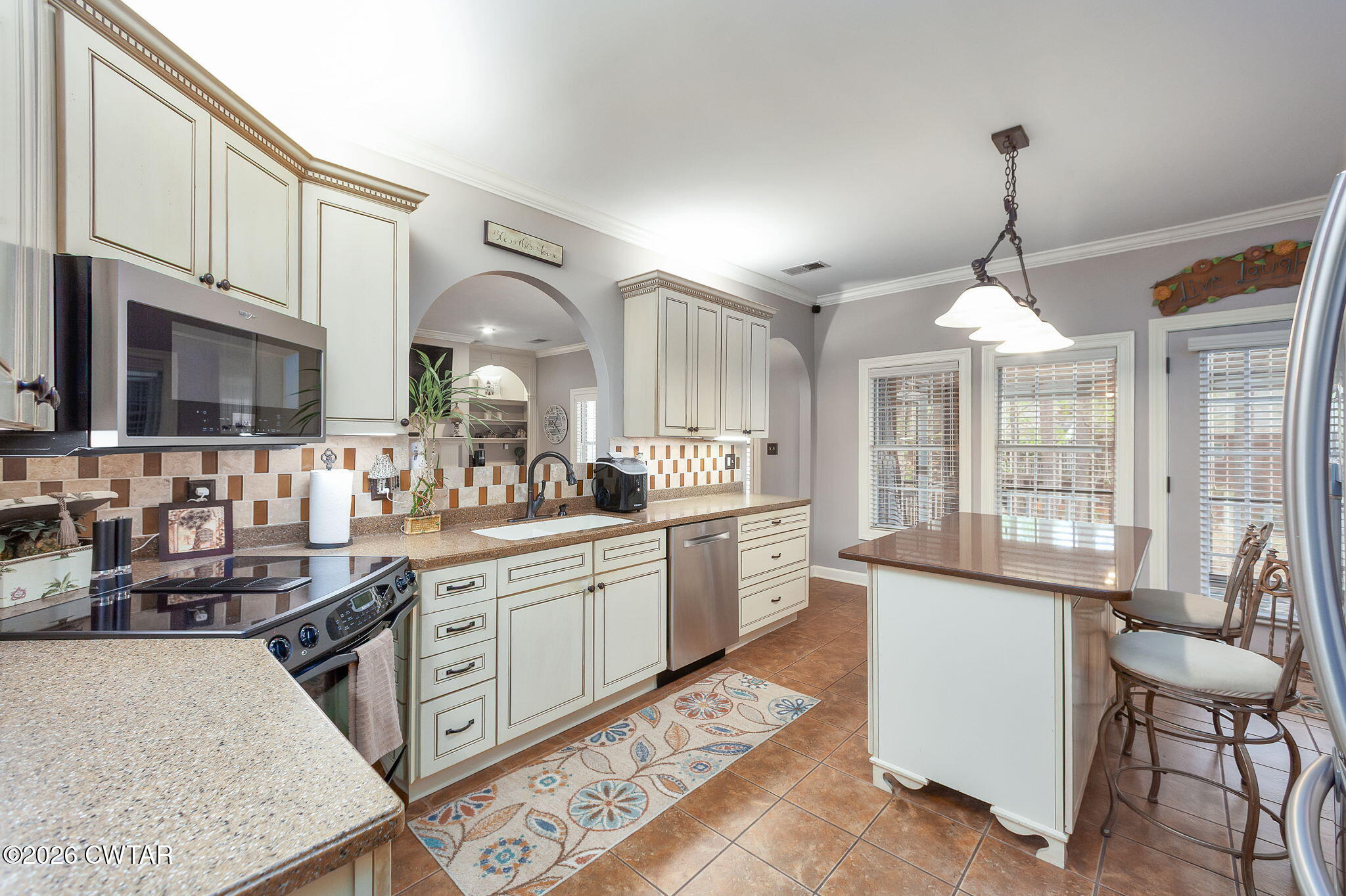 16 Fields Chase Jackson, TN 38305 - Photo 11 of 47 a kitchen with granite countertop white cabinets and white appliances