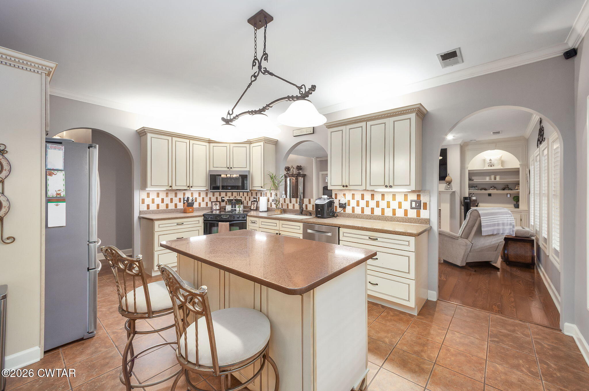 16 Fields Chase Jackson, TN 38305 - Photo 12 of 47 a kitchen with stainless steel appliances kitchen island a chandelier and refrigerator