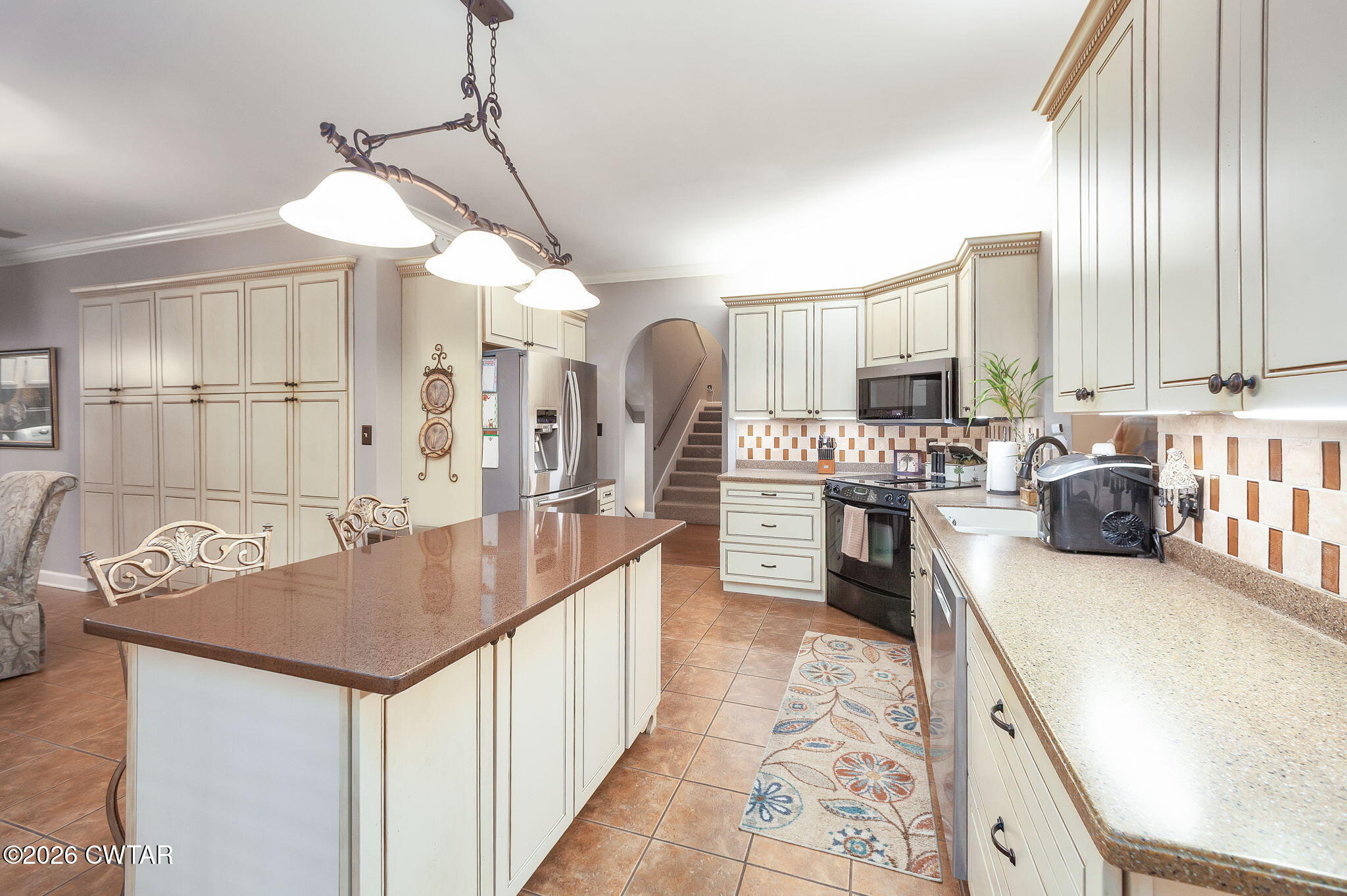 16 Fields Chase Jackson, TN 38305 - Photo 13 of 47 a kitchen with stainless steel appliances granite countertop a sink stove and refrigerator