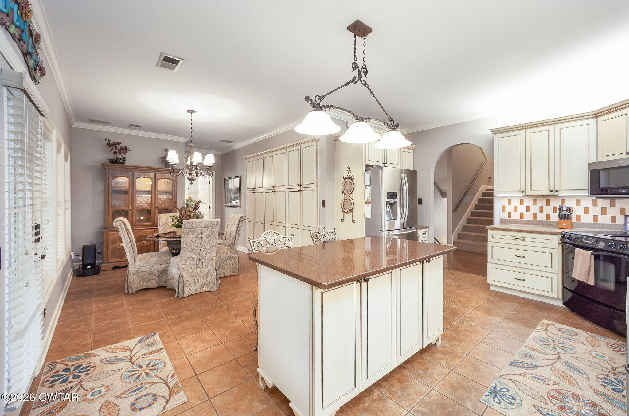 16 Fields Chase Jackson, TN 38305 - Photo 14 of 47 a large white kitchen with a large island oven a stove and a chandelier