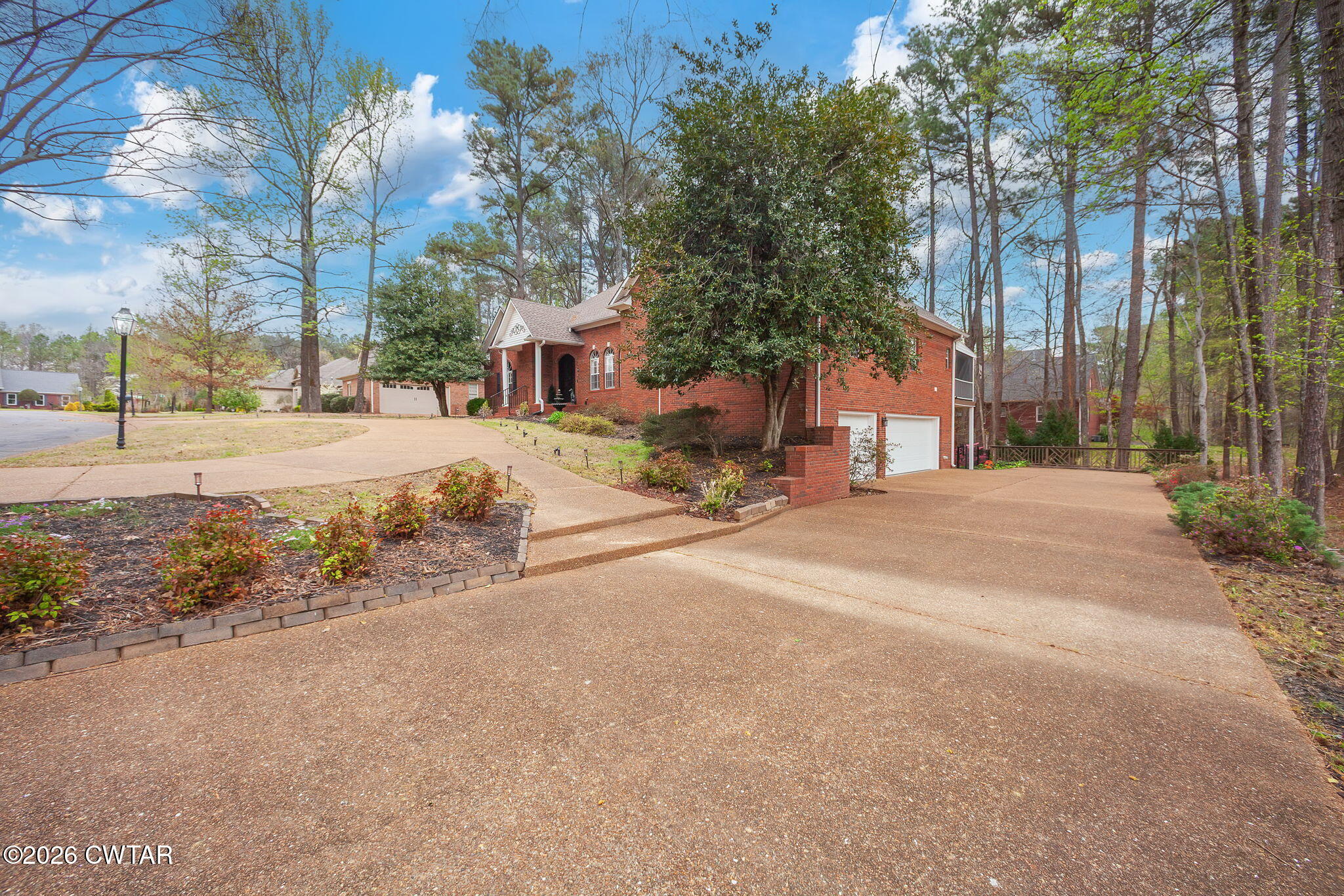 16 Fields Chase Jackson, TN 38305 - Photo 2 of 47 a view of road with large trees