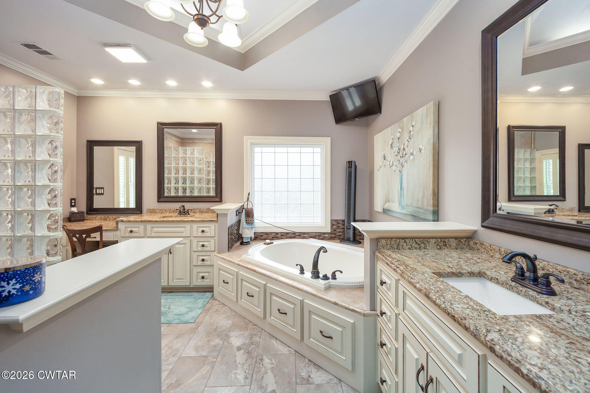 16 Fields Chase Jackson, TN 38305 - Photo 21 of 47 a bathroom with a granite countertop double vanity sink a mirror and a bathtub