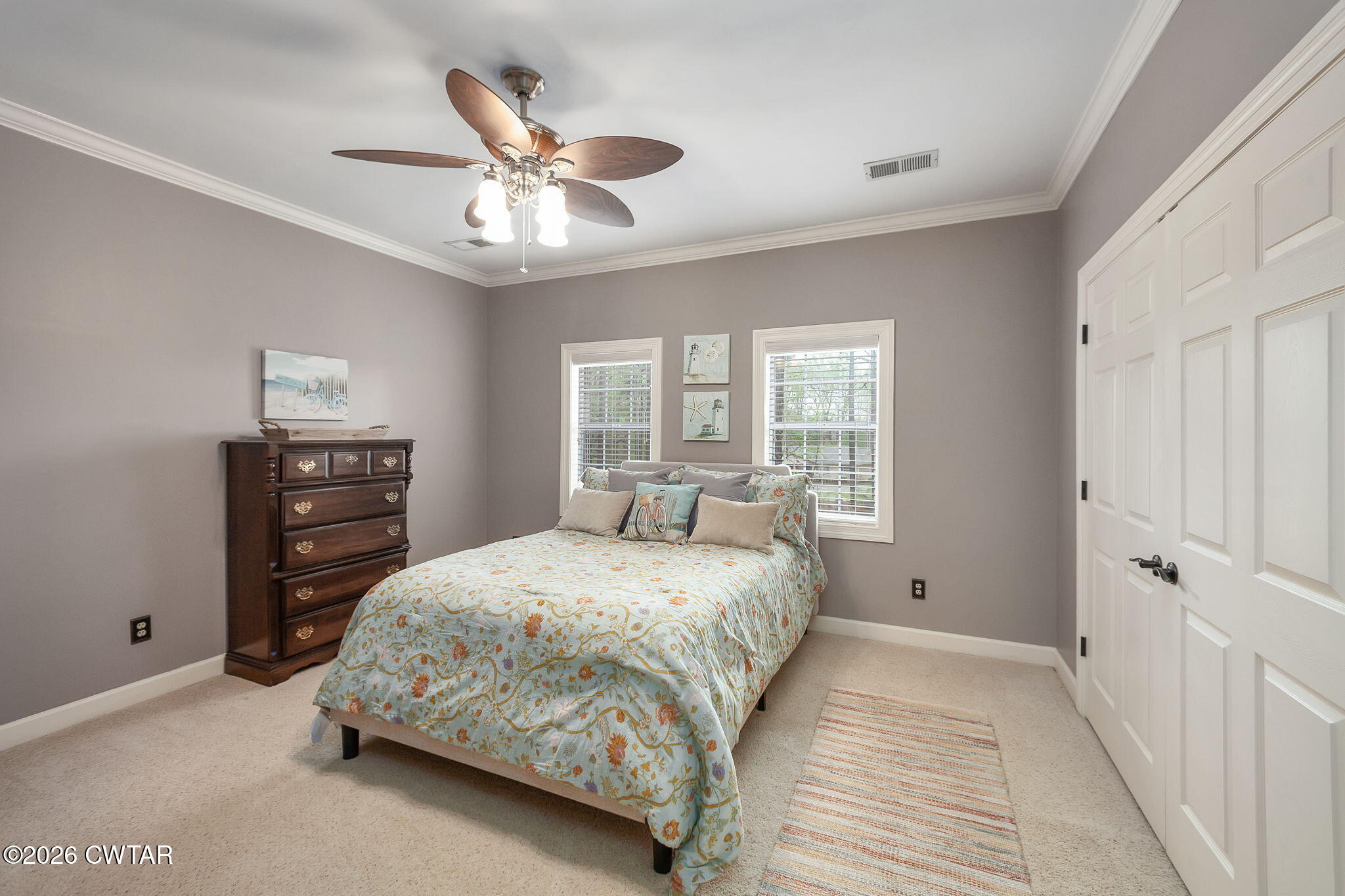 16 Fields Chase Jackson, TN 38305 - Photo 23 of 47 a bedroom with a large bed and a chandelier