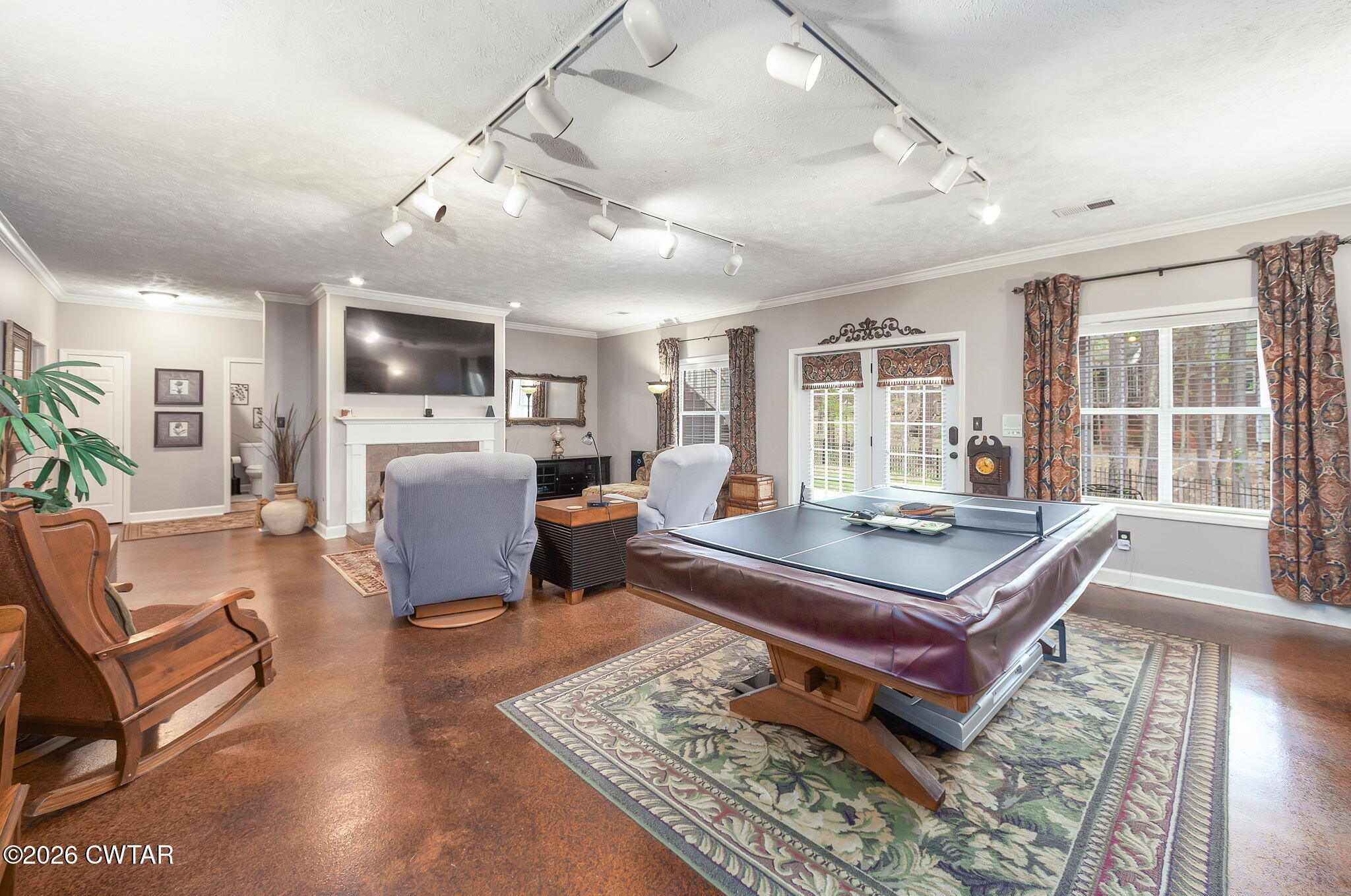 16 Fields Chase Jackson, TN 38305 - Photo 33 of 47 a living room with furniture a flat screen tv and a table