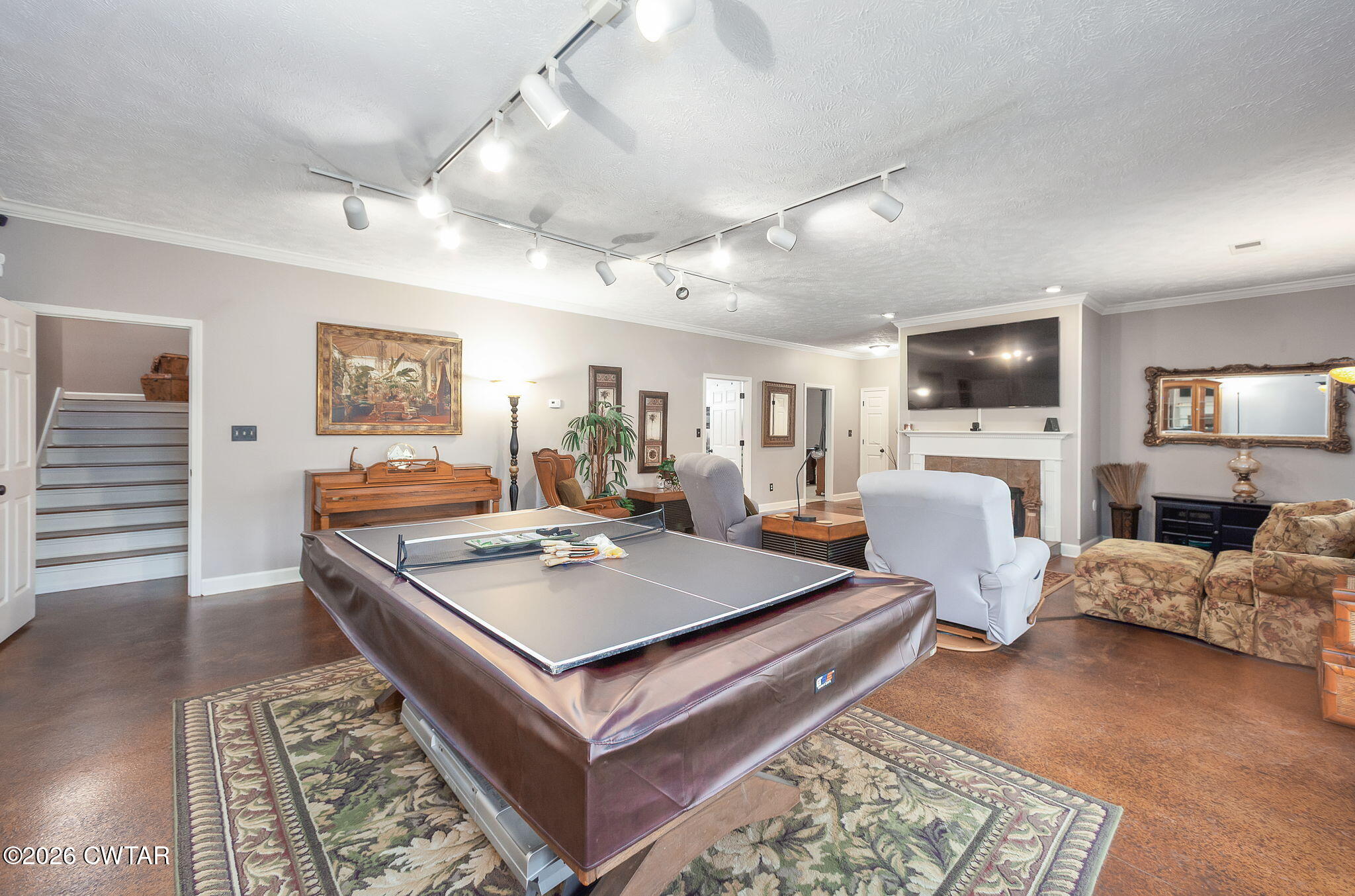 16 Fields Chase Jackson, TN 38305 - Photo 34 of 47 a living room with furniture a fireplace and a flat screen tv