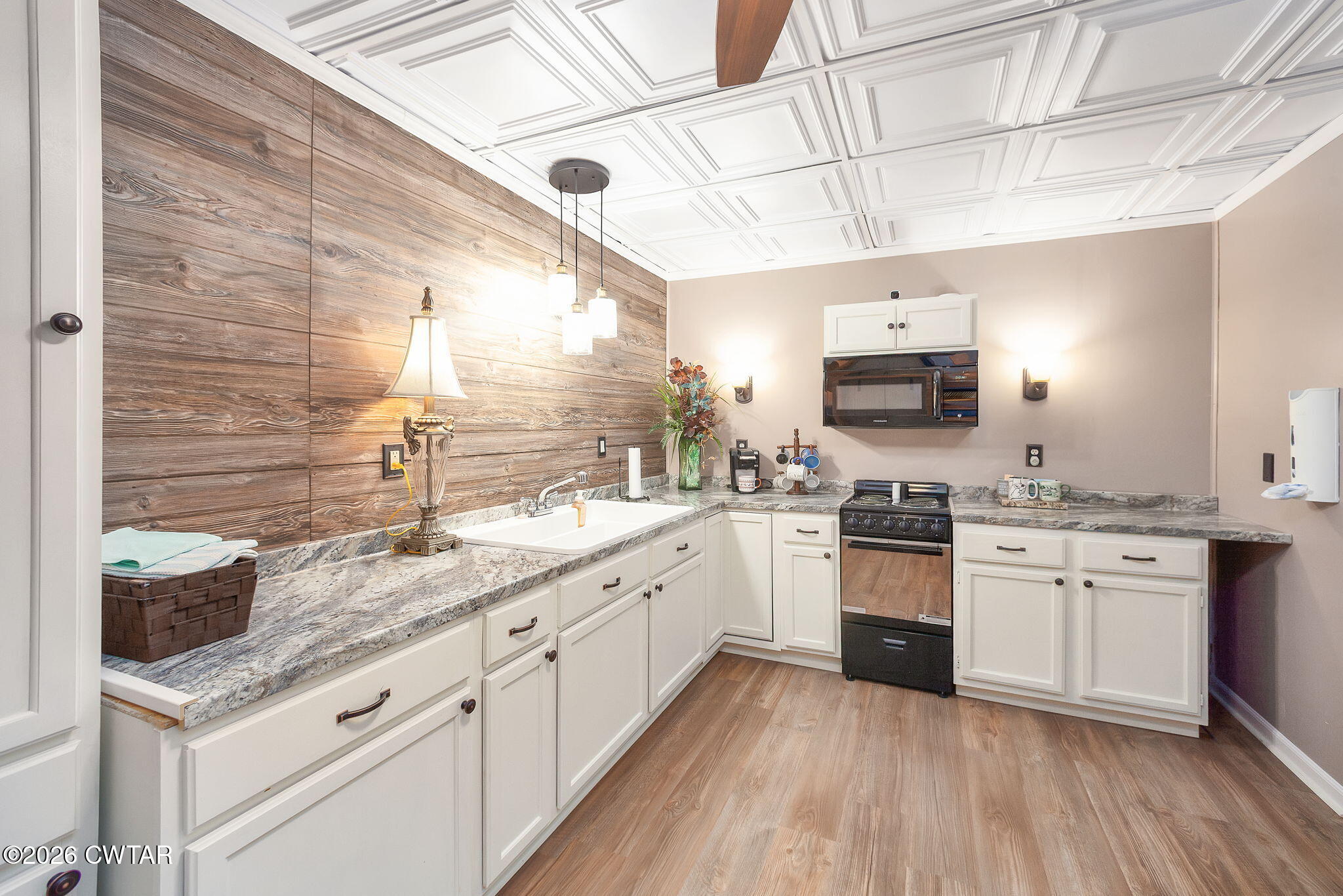 16 Fields Chase Jackson, TN 38305 - Photo 37 of 47 a kitchen with stainless steel appliances granite countertop a sink a stove and cabinets